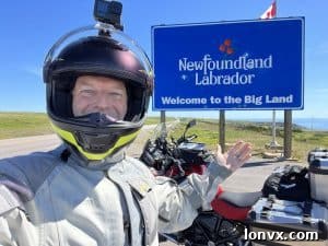 Bruce Johnson smiling with a motorcycle helmet