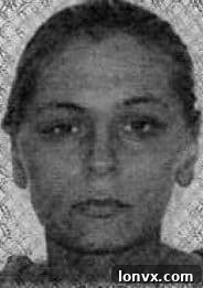 Image of a woman wanted in a real estate fraud investigation by Toronto Police Services.