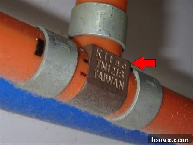 Close-up of a corroded Kitec plumbing fitting.