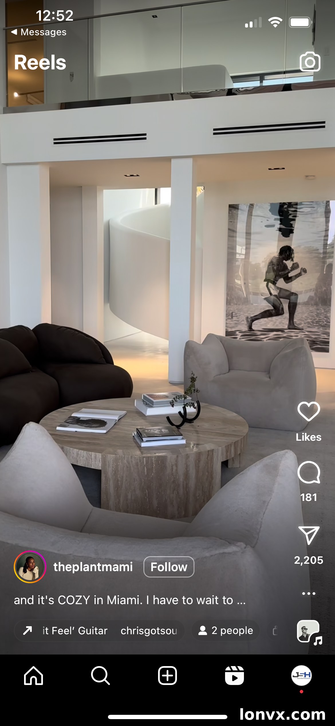 Person relaxing in a beautifully designed living room, embodying the 'Soak It In' Instagram Reel trend for real estate