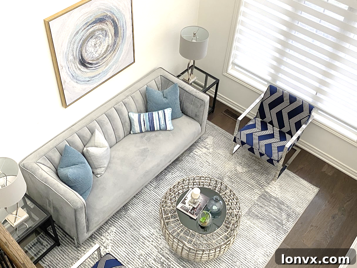Modern living room staged with contemporary furniture and decor, featuring a bright, airy space with large windows and a subtle color palette.