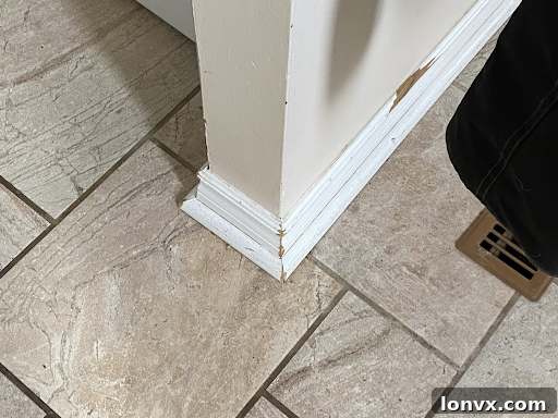 Bathroom with a leaky faucet dripping water, highlighting a common household repair issue that can deter buyers.