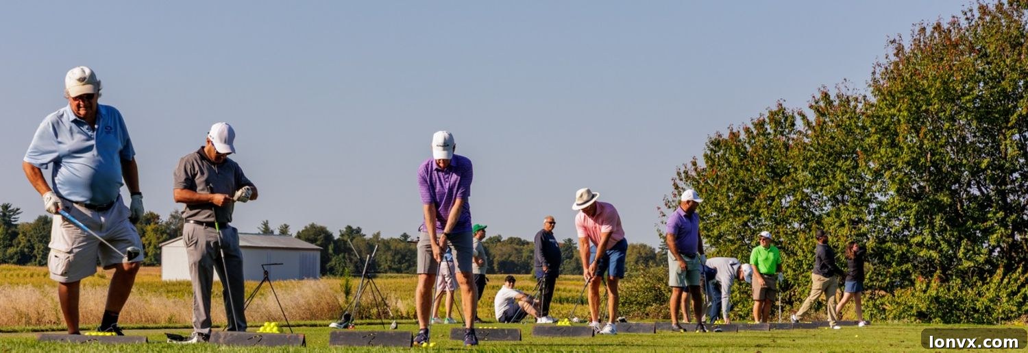Golfers warming up for a charity tournament in the early morning.