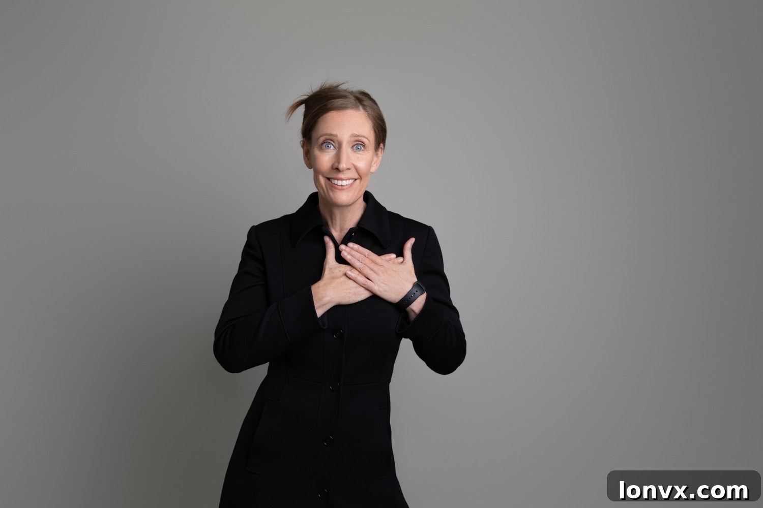 Catharine MacIntosh, Founder of Listed, smiles confidently.